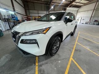 White Nissan Rogue front angle after detail